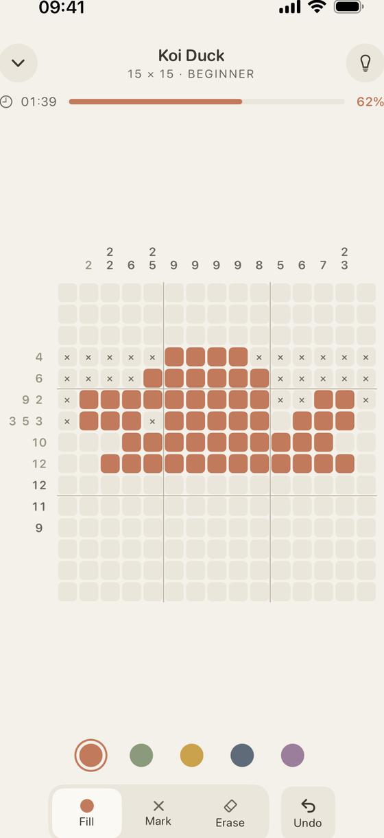 A 15×15 nonogram in progress, its clue numbers lining the grid